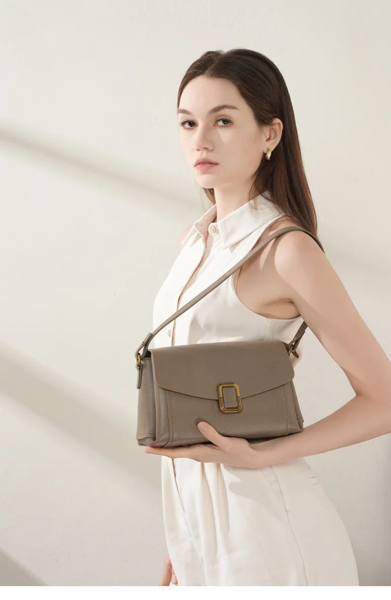 Bolsa feminina portátil de couro genuíno 2025, novo nicho de alta qualidade, bolsa de ombro crossbody, bolsa de viagem feminina com duas alças