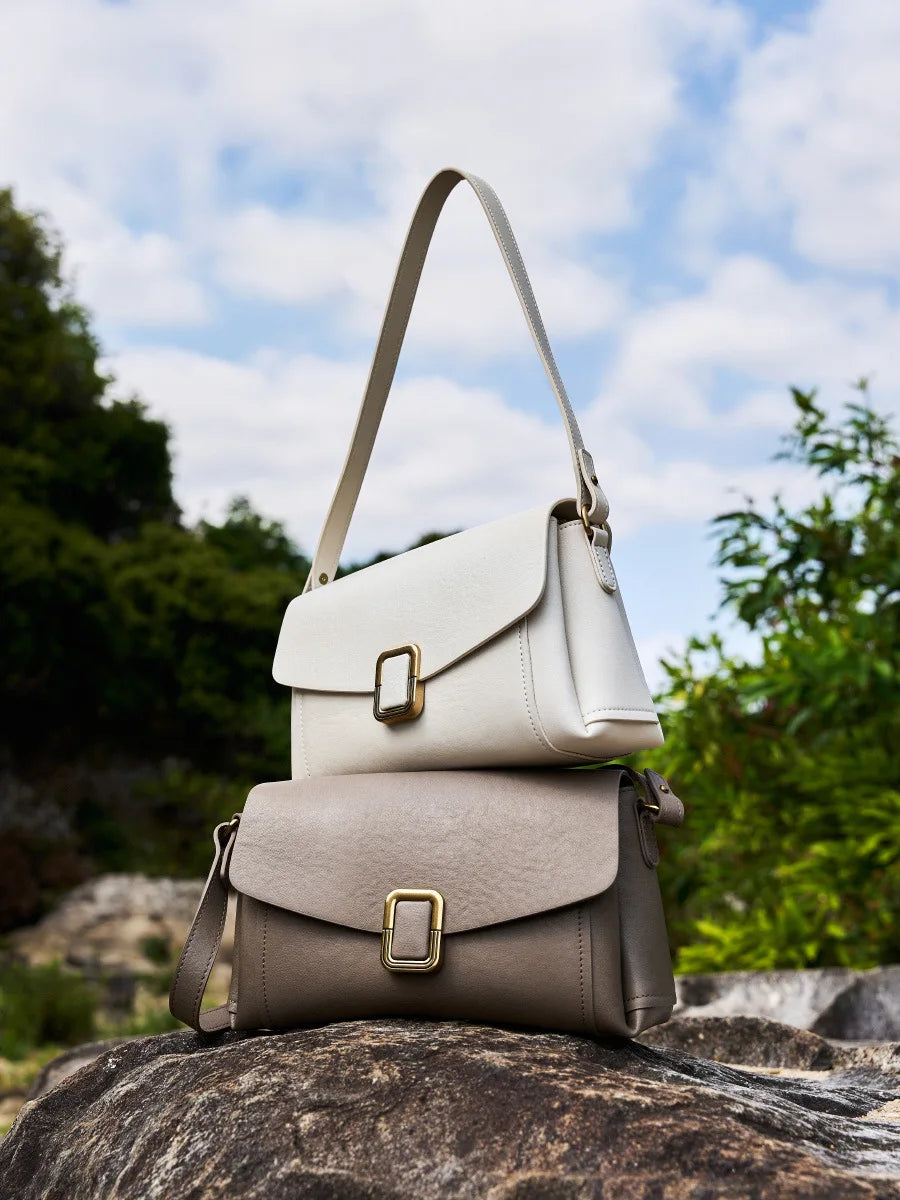 Bolsa feminina portátil de couro genuíno 2025, novo nicho de alta qualidade, bolsa de ombro crossbody, bolsa de viagem feminina com duas alças