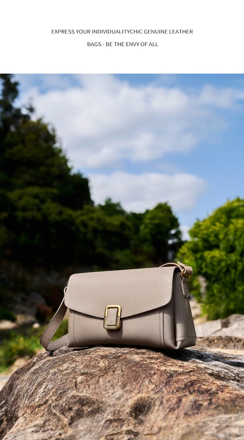 Bolsa feminina portátil de couro genuíno 2025, novo nicho de alta qualidade, bolsa de ombro crossbody, bolsa de viagem feminina com duas alças
