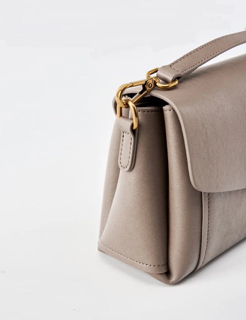 Bolsa feminina portátil de couro genuíno 2025, novo nicho de alta qualidade, bolsa de ombro crossbody, bolsa de viagem feminina com duas alças