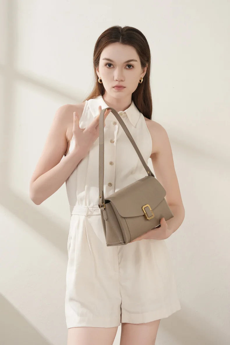 Bolsa feminina portátil de couro genuíno 2025, novo nicho de alta qualidade, bolsa de ombro crossbody, bolsa de viagem feminina com duas alças