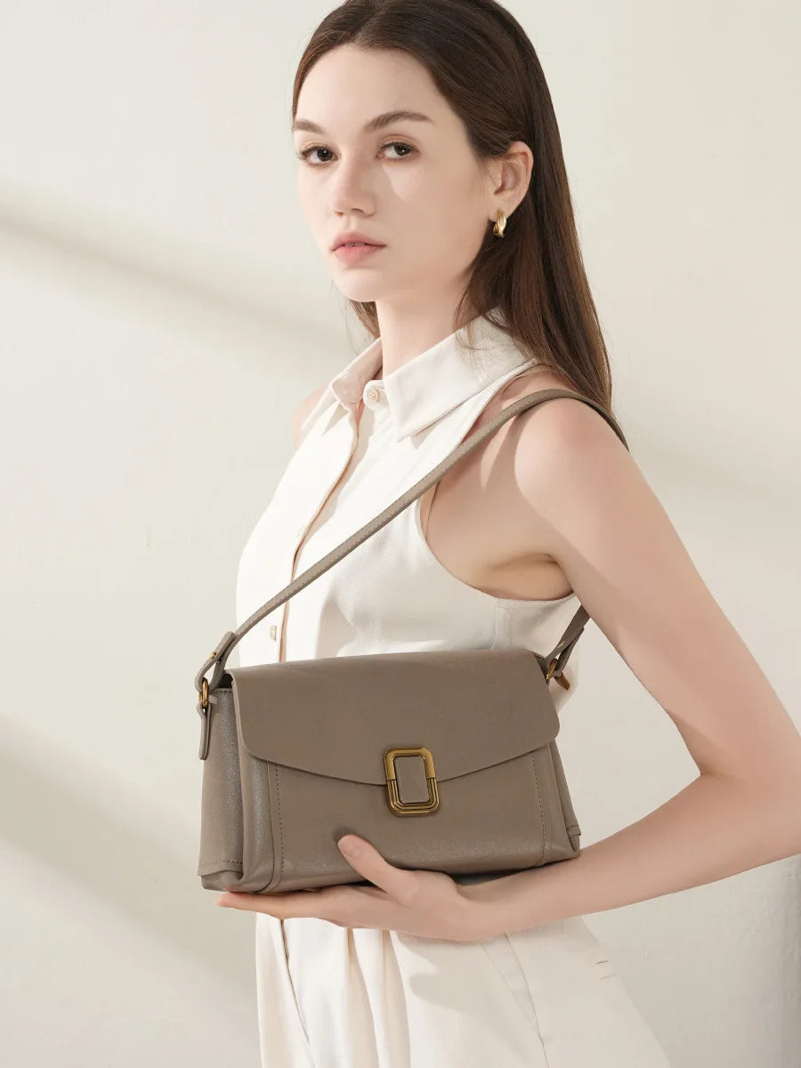 Bolsa feminina portátil de couro genuíno 2025, novo nicho de alta qualidade, bolsa de ombro crossbody, bolsa de viagem feminina com duas alças